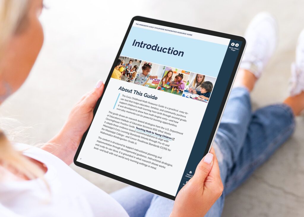 woman holding a tablet with the early learning math guide